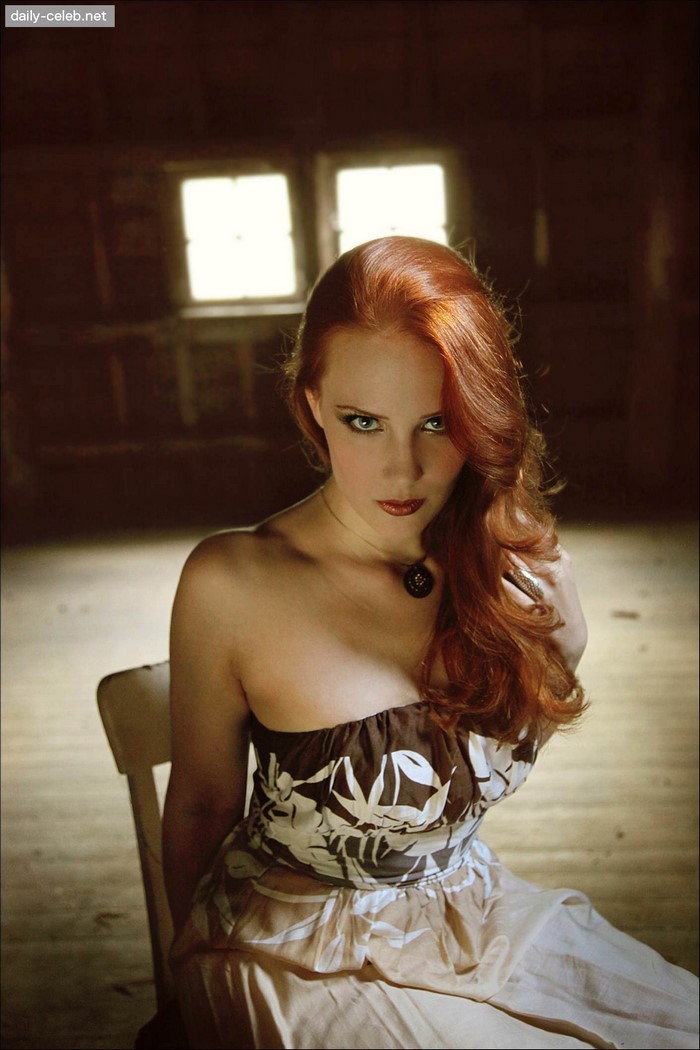 Woman with red hair in a strapless dress