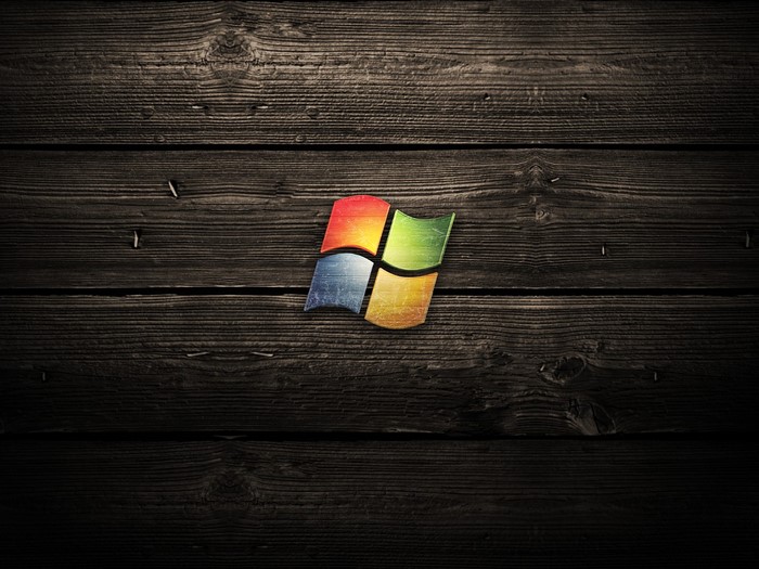 Microsoft Windows logo on dark wood texture