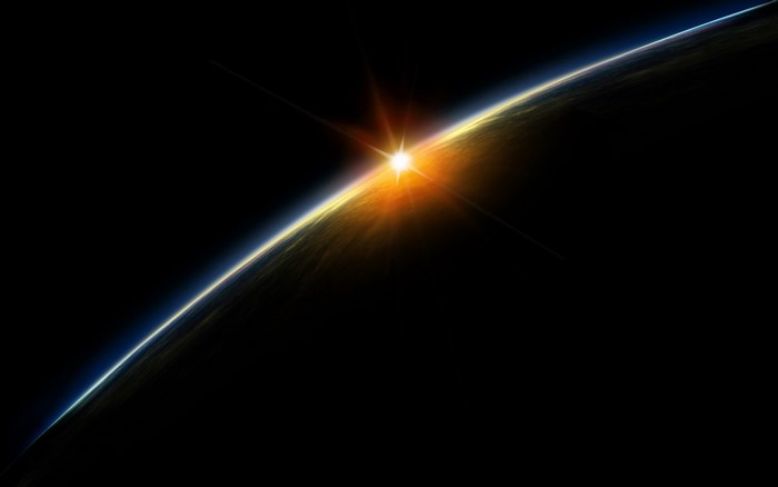 Sunrise over Earth from space with lens flare