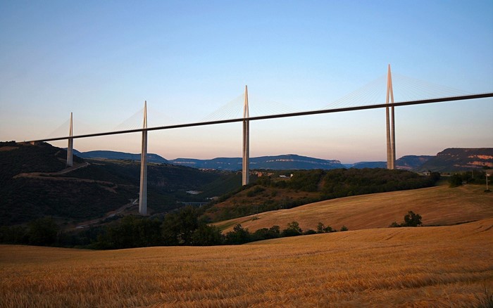 Millau Viaduct bridge over a valley at sunset