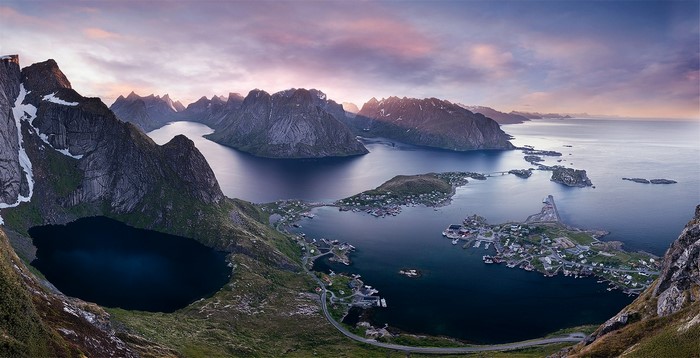 Panoramic view of a Norwegian coastal town with mountains
