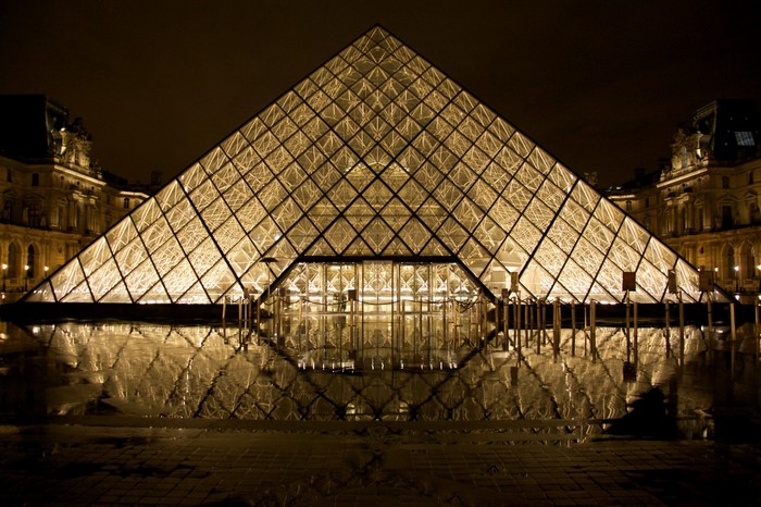 Louvre Pyramid at night with reflection