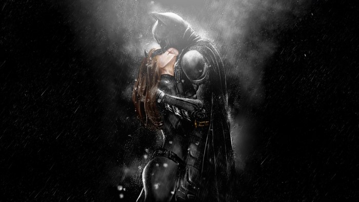 Batman and Catwoman kissing in the rain