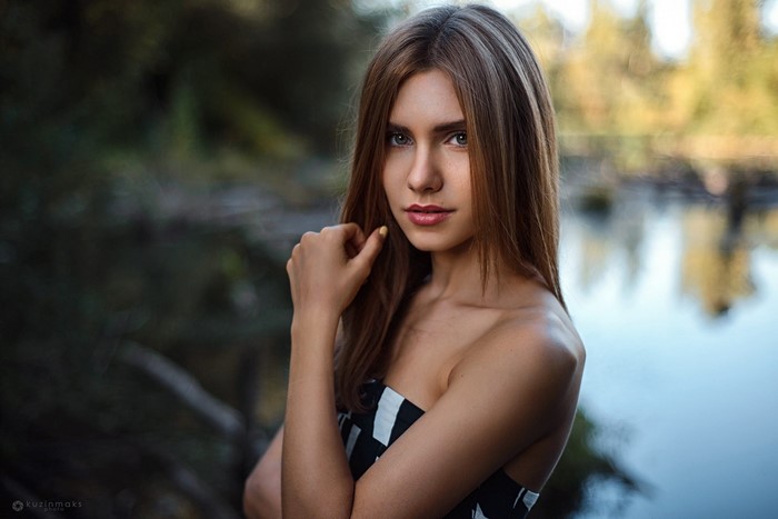 Portrait of a Woman with Long Brown Hair by Water
