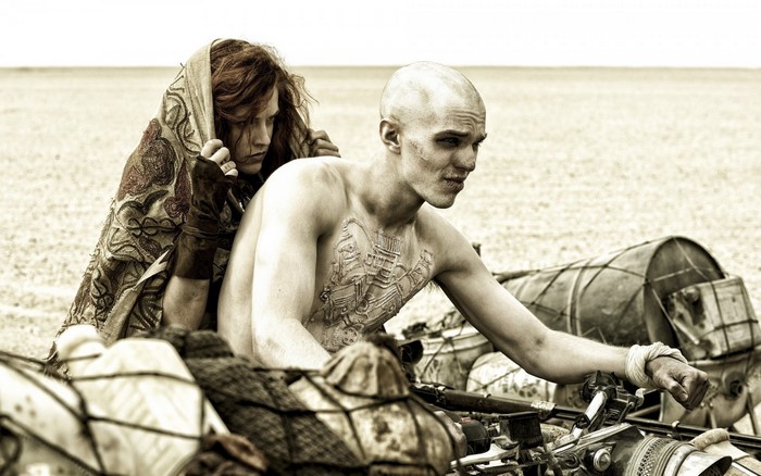 Couple from Mad Max: Fury Road on a motorcycle