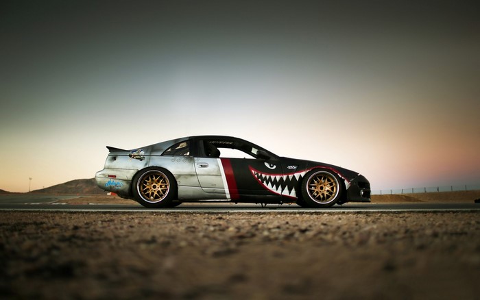Nissan 300ZX with shark mouth livery on a race track