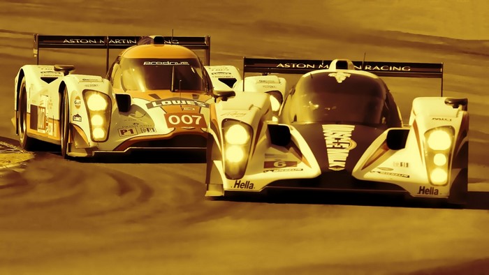 Aston Martin Racing cars on a track