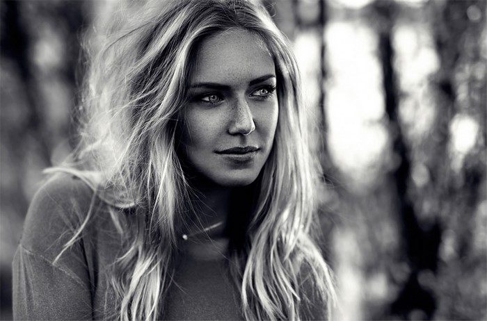 Black and white portrait of a woman with long blonde hair