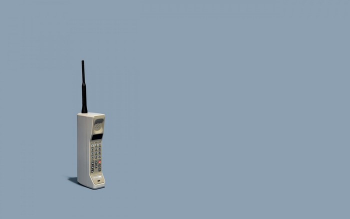Motorola DynaTAC cellphone on a blue background