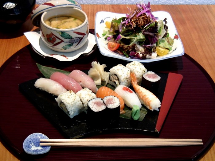 Japanese sushi meal with miso soup and salad