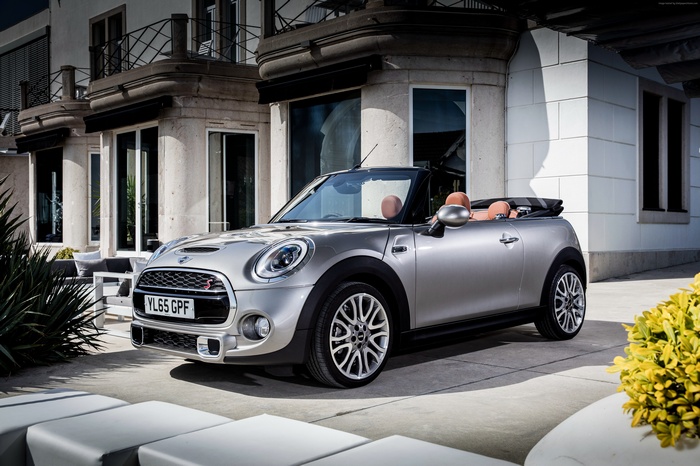 Silver Mini Cooper S Cabriolet parked near a building