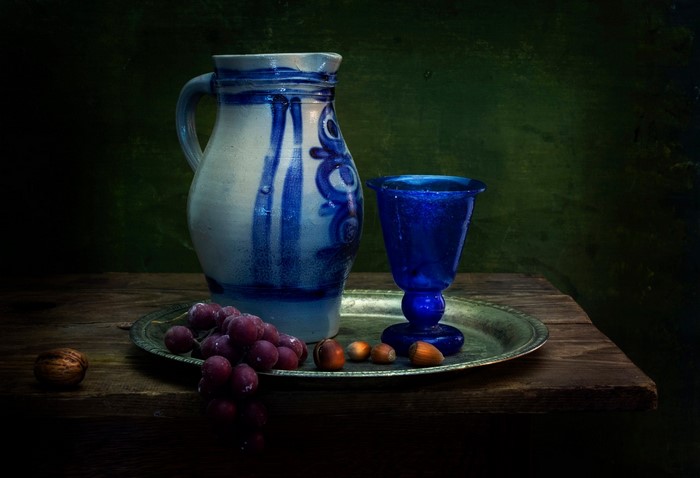 Still life with pitcher, glass, grapes, and nuts