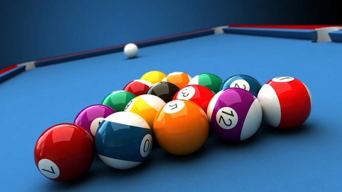 Billiard balls racked on a blue pool table