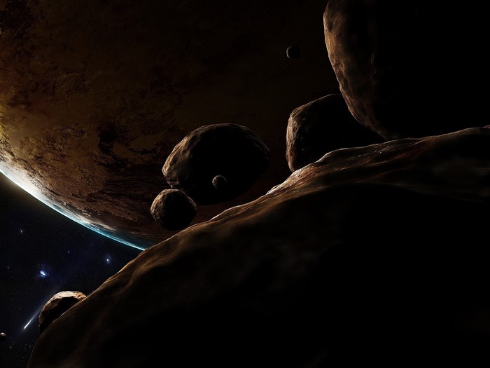 Asteroids and planet in outer space