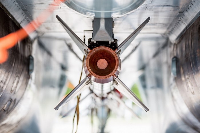 Close-up of a missile mounted on a military aircraft