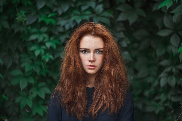 Redhead woman with blue eyes and freckles