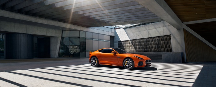 Orange Jaguar F-Type SVR parked under a modern building