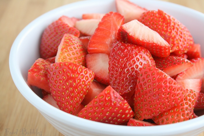 Bowl of sliced strawberries