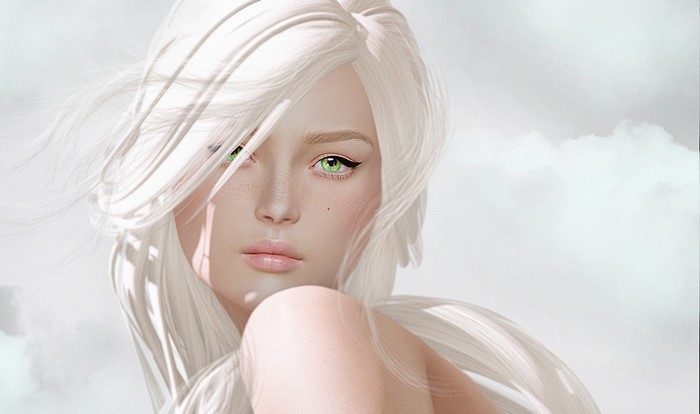 Close up of a woman with white hair and green eyes