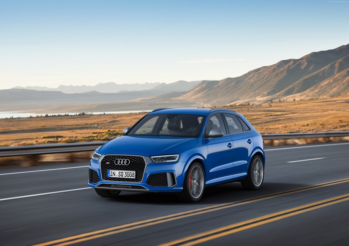 Blue Audi RS Q3 performance (8U) driving on a road