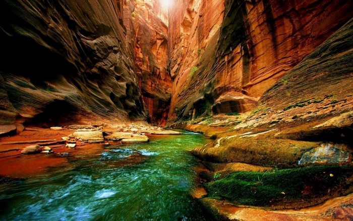 River flowing through a colorful sandstone canyon