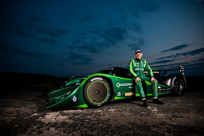 Racer in green suit with Drayson Racing B12/69 electric car