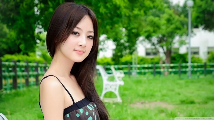 Portrait of a Young Asian Woman in a Polka Dot Dress