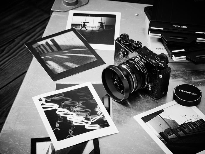 Olympus PEN-F mirrorless camera with photos