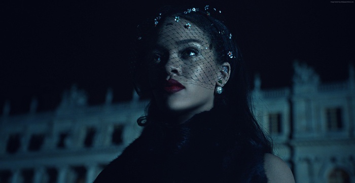 Rihanna wearing a veil and jewelry