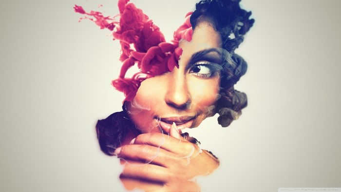 Woman with red and blue ink splashes on face