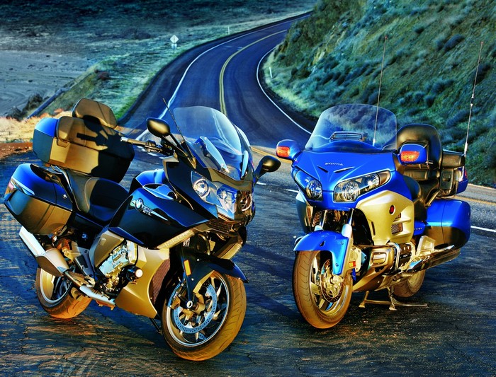 Two touring motorcycles on a winding road