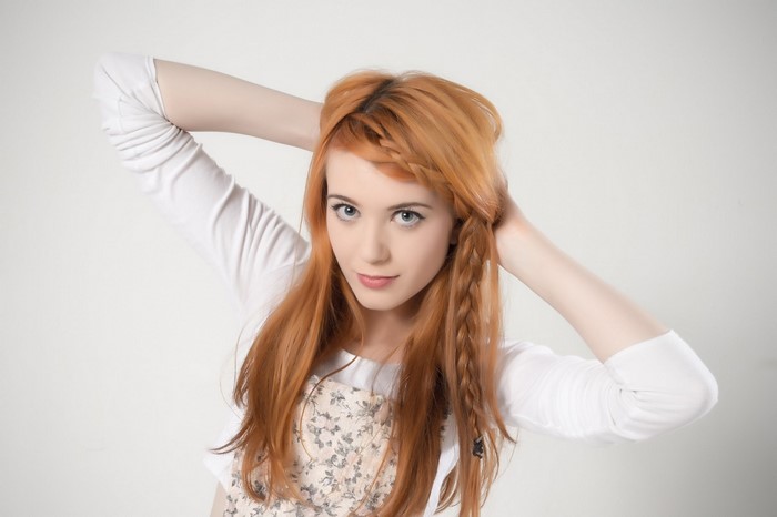 Woman with long red hair and braids