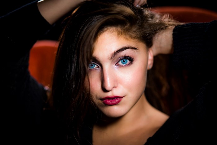 Woman with blue eyes and dark hair