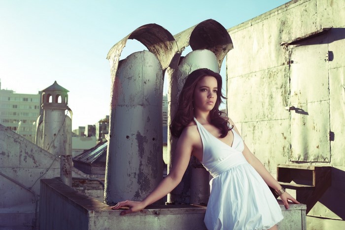 Woman in white dress on a rooftop
