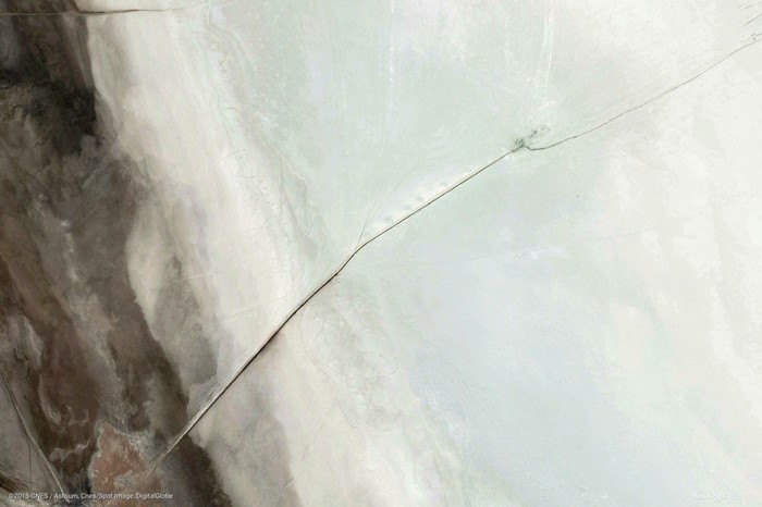 Aerial view of a cracked, dry landscape