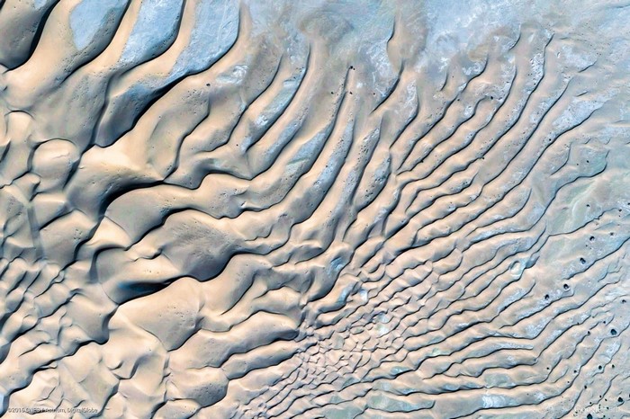 Aerial view of sand dunes and geological formations