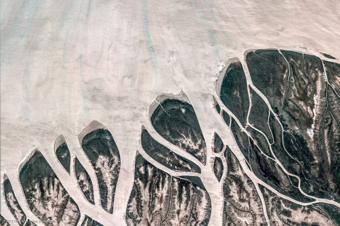 Aerial view of a delta with dark water channels