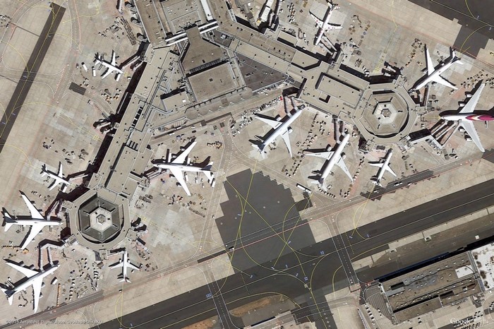 Aerial view of an airport terminal with airplanes