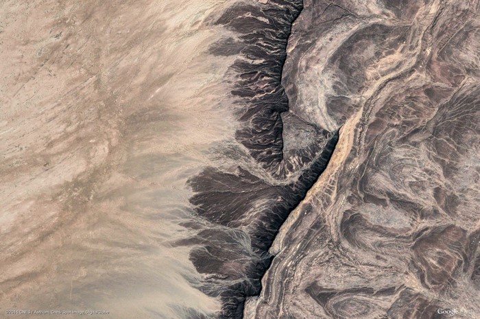 Aerial view of a desert canyon with geological formations