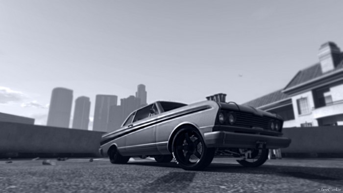 Tuned classic car in front of city skyline