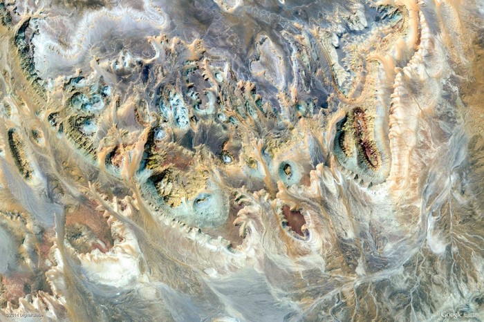 Aerial view of colorful desert landscape with geological formations