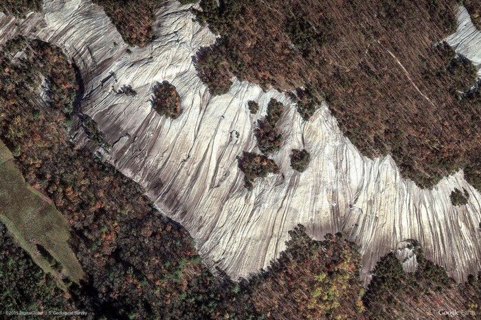 Aerial view of a rocky landscape with trees in autumn