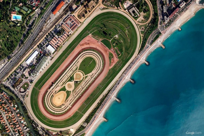Aerial view of a race track by the sea