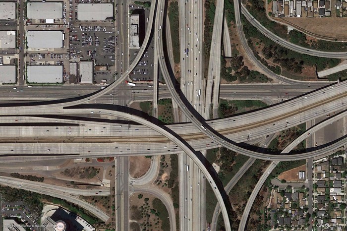 Aerial view of a complex highway interchange with multiple overpasses and lanes