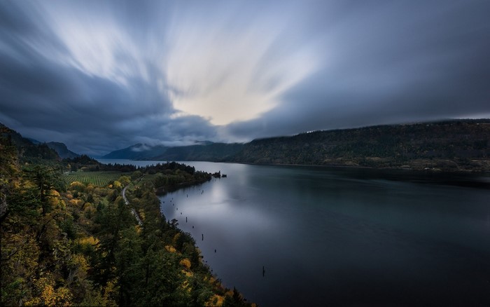 River landscape with clouds and trees in fall