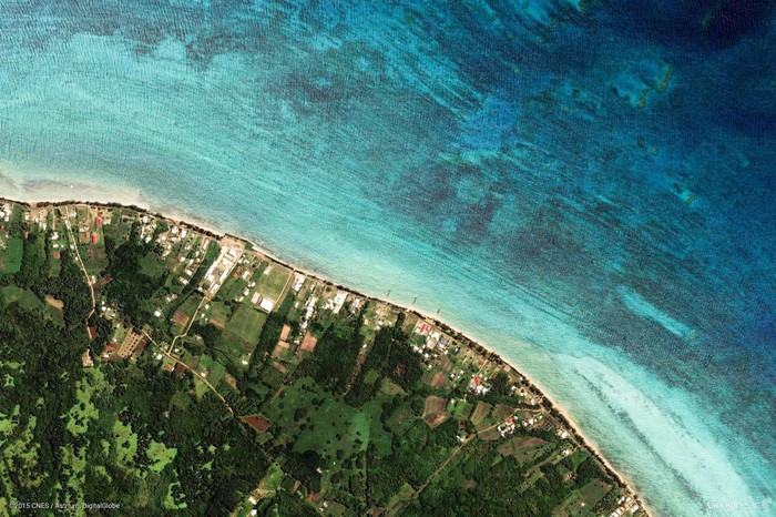Aerial view of a tropical coastline with turquoise water