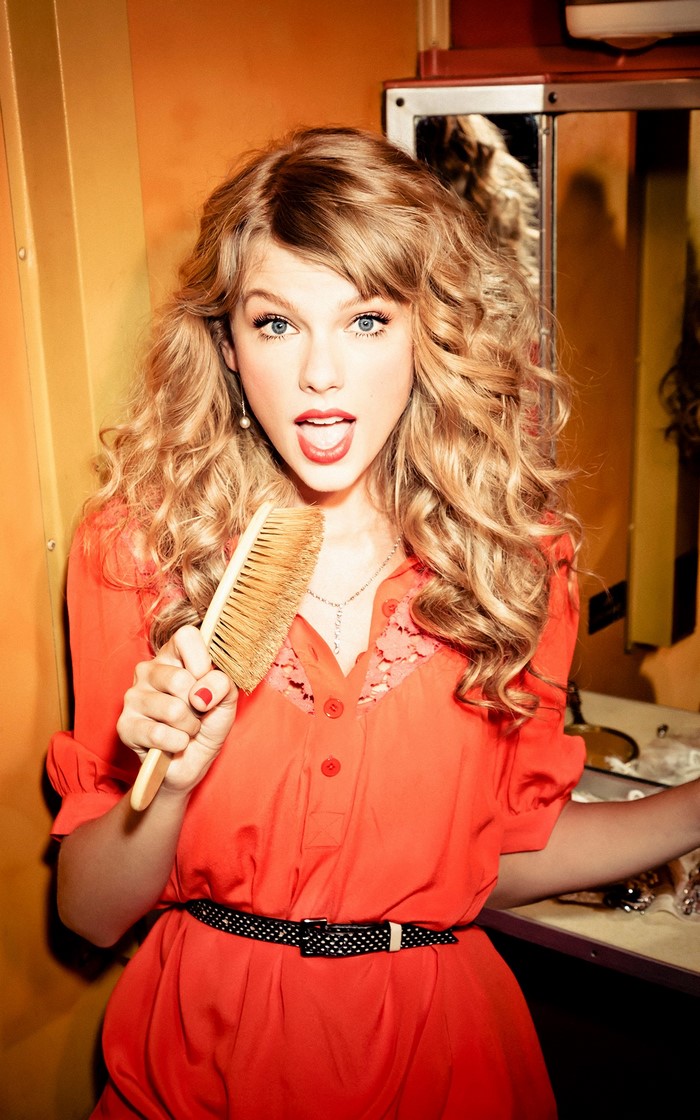 Taylor Swift holding a brush