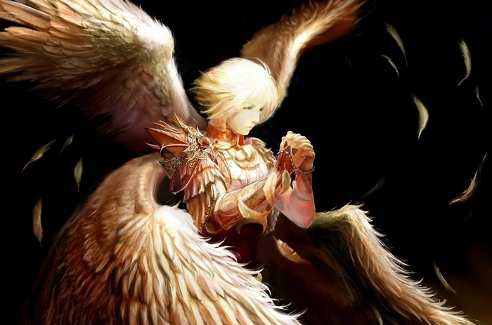 Angel with large feathered wings praying