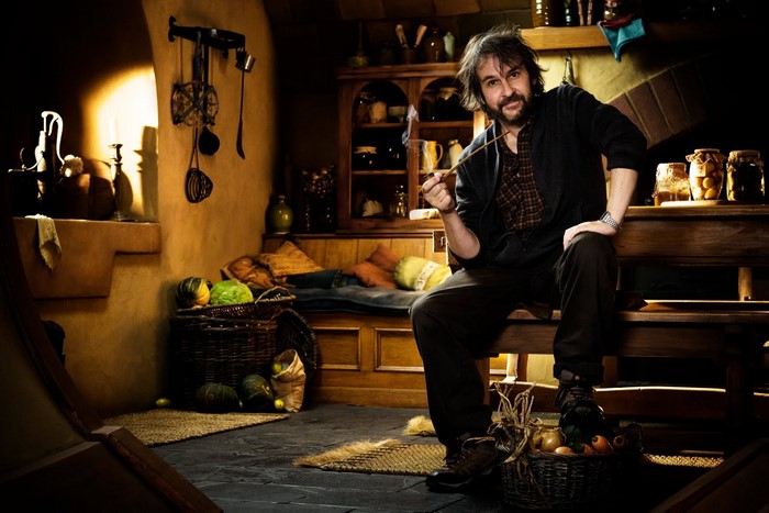 Peter Jackson smoking a pipe in a hobbit hole kitchen