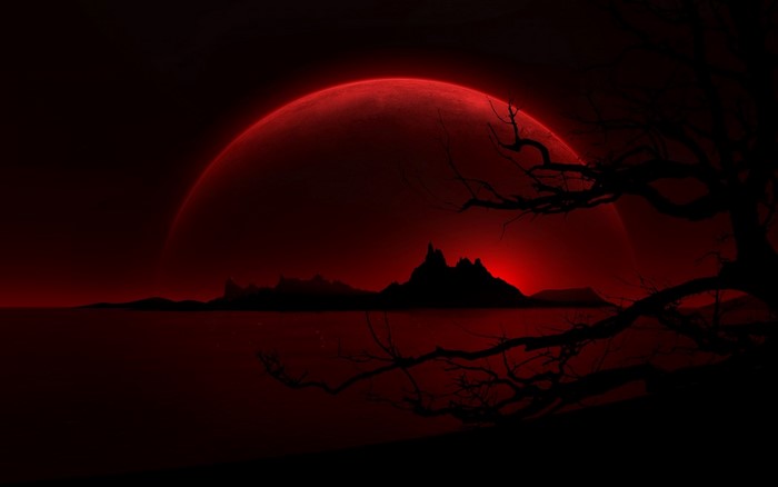 Red moon over a dark landscape with a silhouetted tree